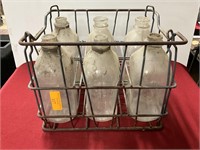 Metal milk crate with 6 glass bottles