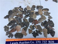 Assortment of broken arrowheads & flint stones. -