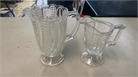 Two Clear Glass Pitchers