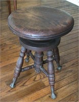 Antique oak piano stool with ball and claw feet