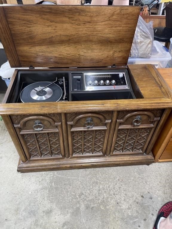 Mid-century showcase, record player, and cassette