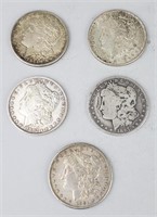 1881-S, 2 1887-O & 2 1921 Silver Morgan Dollars.