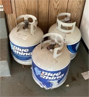 3 empty propane tanks