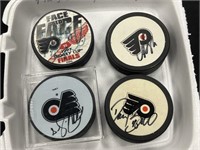 (4) Autographed Hockey Pucks