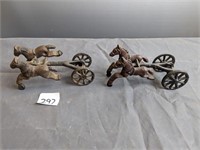 2 smaller cast iron horses with wheeled carriage