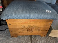 Cushioned foot stool storage with contents