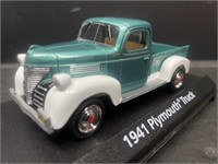 1941 Plymouth Truck in display case. Die cast.