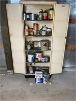 Metal cabinet full of various paints and stains