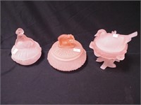 Three pink satin glass covered items: two are