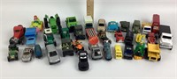 Variety of matchbox style cars, blue truck,