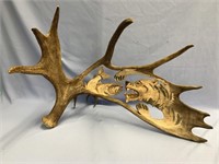 Moose antler relief carving by Jim Bell, of a bear