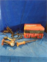 A tools lot that comes with two empty Milwaukee