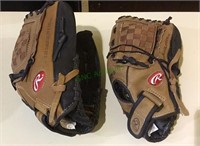 Ball gloves, two Rawlings fastback model ball