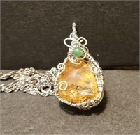 F9)  Necklace hand wrap with a stone