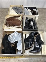 Assortment of high heels boots, most appear to be