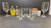 Assorted glass cups and Watkins spices