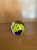 Glass ball with yellow flower