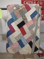 Handmade quilt with gray backing staining and