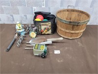 Bocce balls, wood basket, garden tools, dog anchor