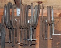 55 clamps hanging on wall: (40) C-clamps up to 8"