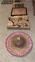 Assorted artwork, framed prints, sombrero, map,