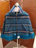 MCM Ladies Poncho with pom poms.