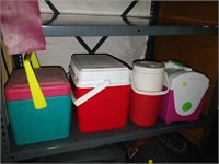 lot of lunch boxes and water jug