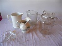 2 glass, 1 pottery, 1 ceramic, 1 plastic Pitchers