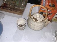 beige tea pot and 3 cups