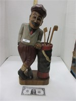 Wooden golfer statue