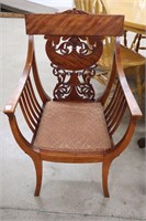 CARVED UPHOLSTERED ARM CHAIR