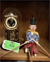 Anniversary clock and tight rope walker toy