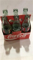 6 pack empty coke bottles