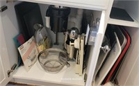 Contents of cupboards under sink in Island -does