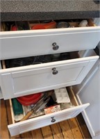Contents of three drawers - left of the sink -