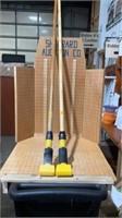 Two Rubbermaid mop handles