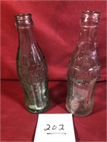 2 vintage Coke bottles