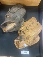 2 Baseball Gloves.