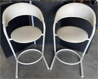 2 white metal based bar stools