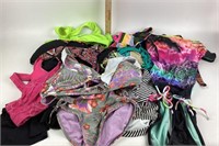 Bathing suit tops, some with tags.