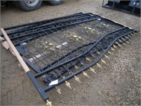 Unused bi-parting wrought iron driveway gates