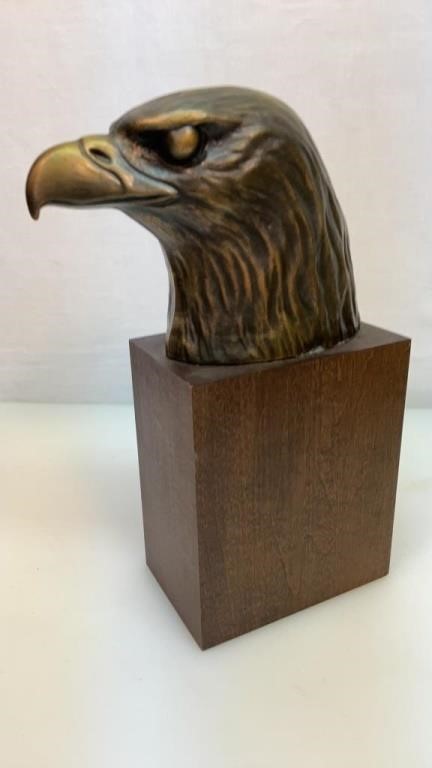 Heavy metal eagle head on wood base