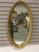 38" by 22" oval wall mirror