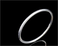 A heavy silver bangle