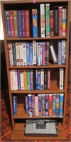DVD Display Case with DVDs and cassette tapes with