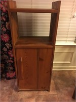 REAL WOOD CABINET. STAND THAT IS 48 INCHES TALL