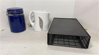 Small electric kettle, blue storage jar, and a