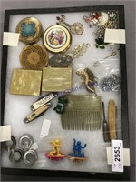 Showcase--pocket knives, jewelry, compacts,