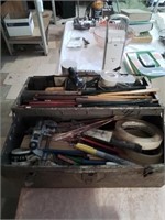 Old metal tool box filled with miscellaneous