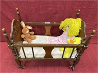 Baby bed with assorted toys